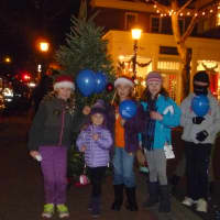 <p>These kids happily attended the New Canaan Holiday Stroll on Friday, getting into the spirit around a Christmas tree. </p>