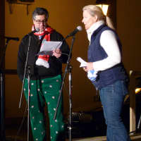 <p>New Canaan First Selectman Robert Mallozzi III, left, in some Christmas-themed pants, joins New Canaan Chamber of Commerce Executive Director Tucker Murphy on stage at the Holiday Stroll on Friday. </p>