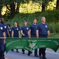 <p>Members of the Lewisboro Volunteer Ambulance Corps (LVAC) march in the South Salem parade.</p>