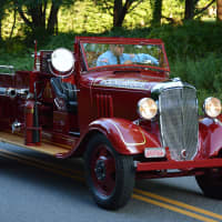 <p>A vintage Pound Ridge firetruck is driven in the South Salem parade.</p>