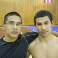 <p>Seniors Kevin Rodriguez, left, and Diego Giron, right, led Port Chester to a 42-35 victory over Harrison in the third-place match at the Tony Carlucci Dual-Meet Tournament Saturday.</p>