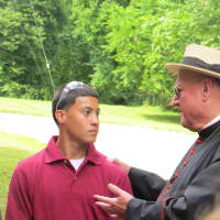<p>Cardinal Timothy Dolan meets Mauricio Agudero, 17, of Ossining, one of the student carpenters building an altar and pulpit for Pope Francis&#x27; visit to New York City next month. </p>
