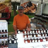 <p>Ron Pinto, owner of Winding Drive, of Woodbury, that specializes in gourmet jams, jellies and marmalades, at the Old Greenwich Farmers Market.</p>