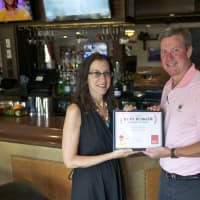 <p>Daily Voice Features Editor Jeanne Muchnick presents first-place certificate to Bogey&#x27;s Owner Jim Stablein.</p>