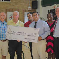 <p>The check presentation at the McGiveney Center.</p>