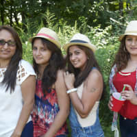 <p>From left: Rosa Patiuo, Grace Ullaguari, Maria Arias and Rosy Arias of Danbury enjoy the weather and the live entertainment at the Ecuadorian Festival.</p>