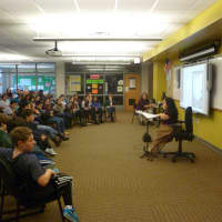 <p>Armonk resident Geri Mariano speaks Tuesday to Seven Bridges Middle School students in Chappaqua.</p>