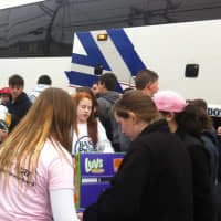 <p>Volunteers with the Somers student group Let&#x27;s Play It Forward unload relief supplies from the bus Sunday in Staten Island.</p>