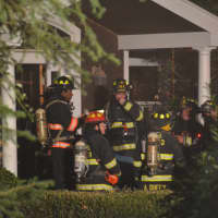 <p>Firefighters respond to a fire in an Armonk house&#x27;s attached garage.</p>