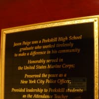 <p>The plaque honoring Paige outside the new fitness center</p>