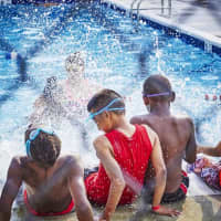 <p>Children enjoy the pool at Camp Felix.</p>