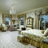 <p>One of the eight bedrooms in the home, which has nearly 20,000 square feet.</p>