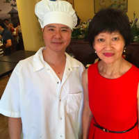 <p>Pearl East restaurant co-owners Ye Sun Ying and Ivy Bacher at the grand opening of their restaurant Thursday.</p>