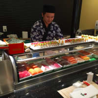 <p>Sushi chef Ocean Chen in action at Pearl East restaurant.</p>