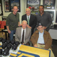 <p>Baseball greats David Cone (left), Barry Larkin (right), Don Larsen (front left) and Yogi Berra (front right) stand with Steiner Sports CEO Brandon Steiner (center) at company headquarters in New Rochelle Wednesday.</p>
