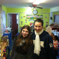 <p>Notre Dame-Fairfield seniors Lauren Jones (left) and Aly Furgiuele (right) deliver turkeys to the Daughters of Charity rescue mission in Bridgeport. </p>