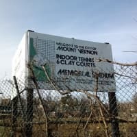 <p>A sign at Memorial Field in Mount Vernon advertises the new tennis courts that are planned to be installed.</p>