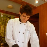 <p>O2living Cafe chef Eric French chops veggies for the salads.</p>