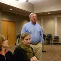<p>Ben Bilus, standing, of New Canaan talks to emergency officials during Thursday&#x27;s post-Hurricane Sandy response meeting. </p>