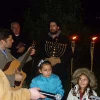 <p>Members of Temple Sholom in Greenwich sing &quot;Maoz Tzur&quot; to commemorate the beginning of Hanukkah.</p>