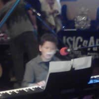 <p>Trent Weschler, 12,  playing and singing &quot;Imagine&quot; by John Lennon</p>