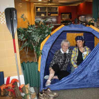 <p>A camper from Waveny LifeCare&#x27;s Adult Day program enjoys time in a tent.</p>
