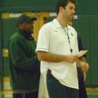 <p>Norwalk boys basketball coach Tom Keyes watches at a recent practice.</p>