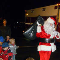 <p>Santa Claus pays a visit to the Pound Ridge youngsters during the tree-lighting ceremony.</p>