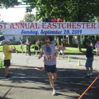 <p>Michael Nobles, winner of last year&#x27;s Eastchester 5K Race, crosses the finish line</p>