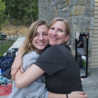 <p>Jen D&#x27;Asto (R) says goodbye to her daughter Gina, a field hockey player moving into Alumni Hall Thursday. The D&#x27;Astos are from Maryland.</p>