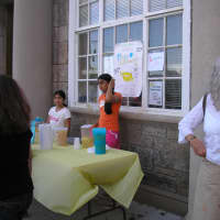 <p>Hupp at a &quot;Roots and Shoots&quot; with some of the children from the community as the sell lemonade</p>