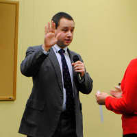 <p>Croton&#x27;s newest trustee, Kevin Davis, is sworn in Monday by Village Clerk Paula DiSanto.</p>