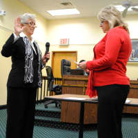 <p>Incumbent Trustee Ann Gallelli is sworn in Monday by Village Clerk Paula DiSanto.</p>
