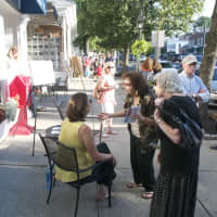 <p>Visitors talk to artists about their work Friday as Ridgefield&#x27;s Art Walk opened.</p>
