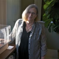 <p>Susan Margolis with some of her gemstone carvings.</p>