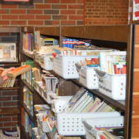 <p>Getting the books ready at South Street School in Danbury. Students will return on Monday, Aug. 24, for the first day of school. </p>