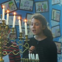 <p>The kids light the Menorah and sing songs for Hanukkah in Stamford. </p>