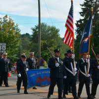 <p>Carmel firefighters march in their 100th anniversary parade.</p>