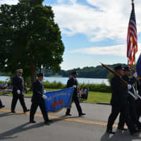 <p>Carmel firefighters march in their 100th anniversary parade.</p>