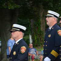 <p>Brewster firefighters march in the Carmel Fire Department&#x27;s 100th anniversary parade.</p>