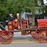 <p>A vintage Carmel firetruck is displayed in the fire department&#x27;s 100th anniversary parade.</p>