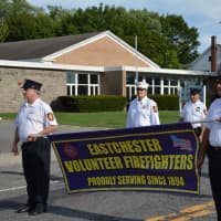 <p>Eastchester firefighters march in the Carmel Fire Department&#x27;s 100th anniversary parade.</p>