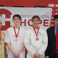 <p>From left: Saturday&#x27;s tournament winners Alexander Turoff, Matt Love and George Whiteside pose with Fairfield Fencing Academy Director Jim Roberts.</p>