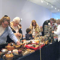 <p>Shoppers browse the tables at last year&#x27;s Antique Stocking Stuffers Show and Sale at John Jay High School in Cross River.</p>