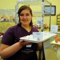 <p>Stephanie Borrell, manager of Dream Cakes, holds up Dream Cakes Bakery&#x27;s cake bites. </p>