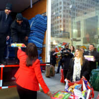 <p>A crew from Two Men and a Truck take all of the toys from the Stamford Media Center to Inspirica. </p>