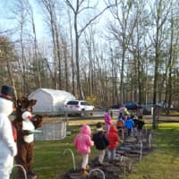 <p>Frosty the Snowman (Taylor Cotter) and Rudolph the Rednosed Reindeer (Megan Beirne) helped supervise the children at Thursday&#x27;s holiday party.</p>