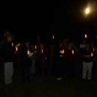 <p>Easton residents held candles to commemorate lost loved ones at the Tree of Light ceremony Thursday evening.</p>