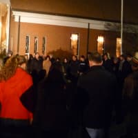 <p>Residents form a prayer circle outside of Saint Rose of Lima Catholic Church in Newtown during a vigil Friday to remember the people who died in a shooting at Sandy Hook Elementary School. </p>