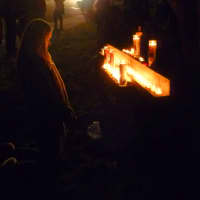 <p>A woman prays before candles lit to honor the victims of Friday&#x27;s shooting at Sandy Hook School in Newtown. </p>